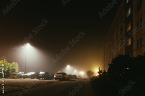 old residential apartment buildings in a foggy night. photo