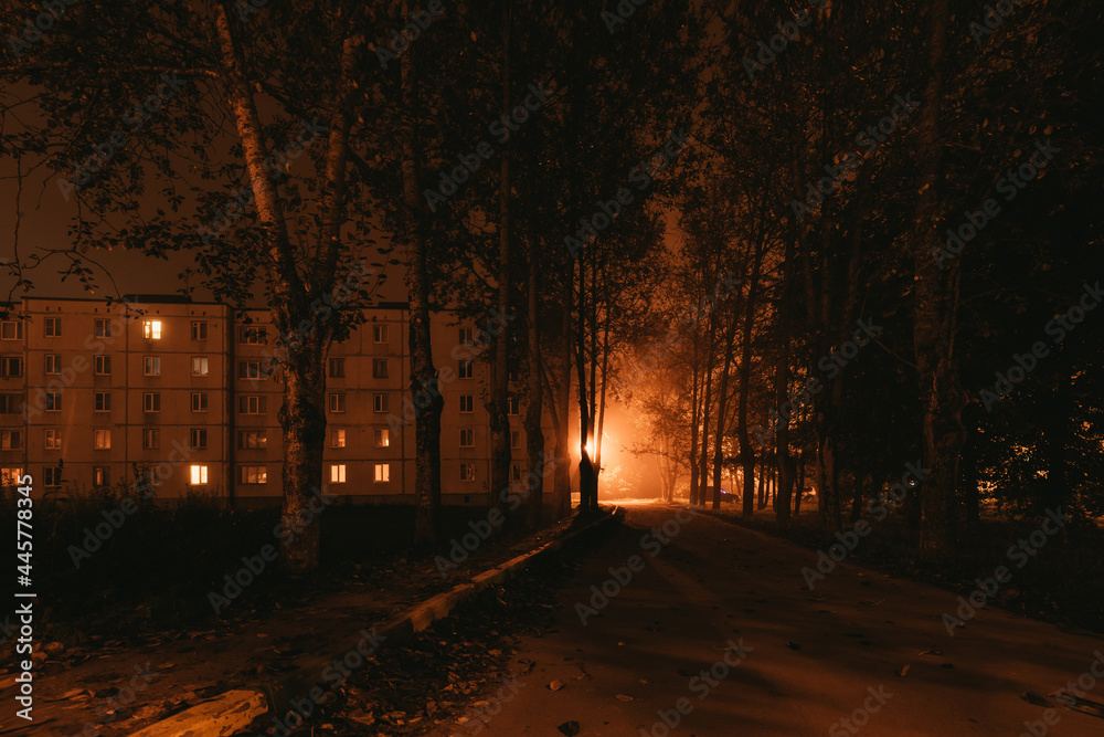 old residential apartment buildings in a foggy night.