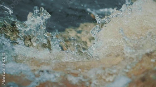 Close-up Super slow-motion shooting of the rapid river threshold.