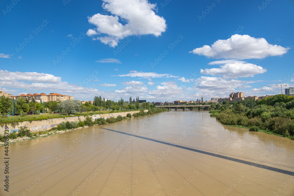 summer landscape on a sunny day view of the Ebro river and bridges in Zaragoza, Spain summer landscape on a sunny day view of the Ebro river and bridges in Zaragoza, Spain