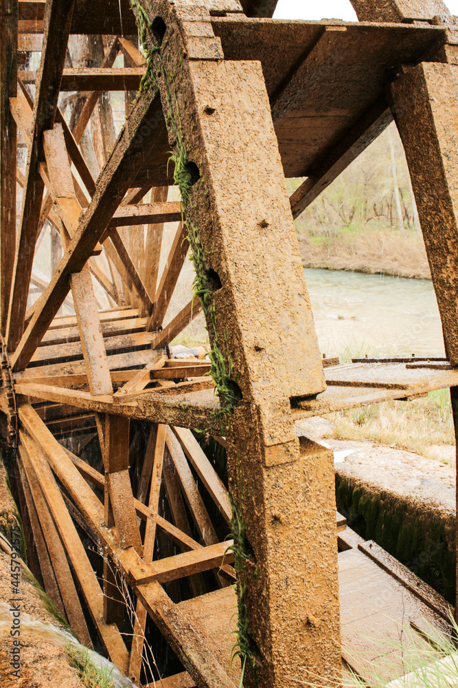 Old wooden waterwheel and Cabriel River on its way through Casas del Rio village, Albacete, Spain.