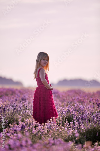 Beautiful blonde girl on lavender field