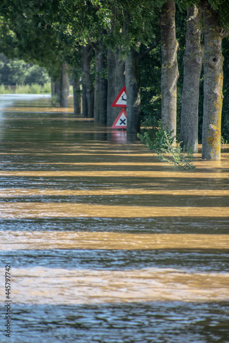 Canvas Print Flooded road and fields after the storm and heavy rain in the Netherlands