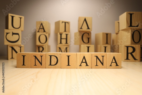 The word Indiana was created from wooden letter cubes. Cities and words.