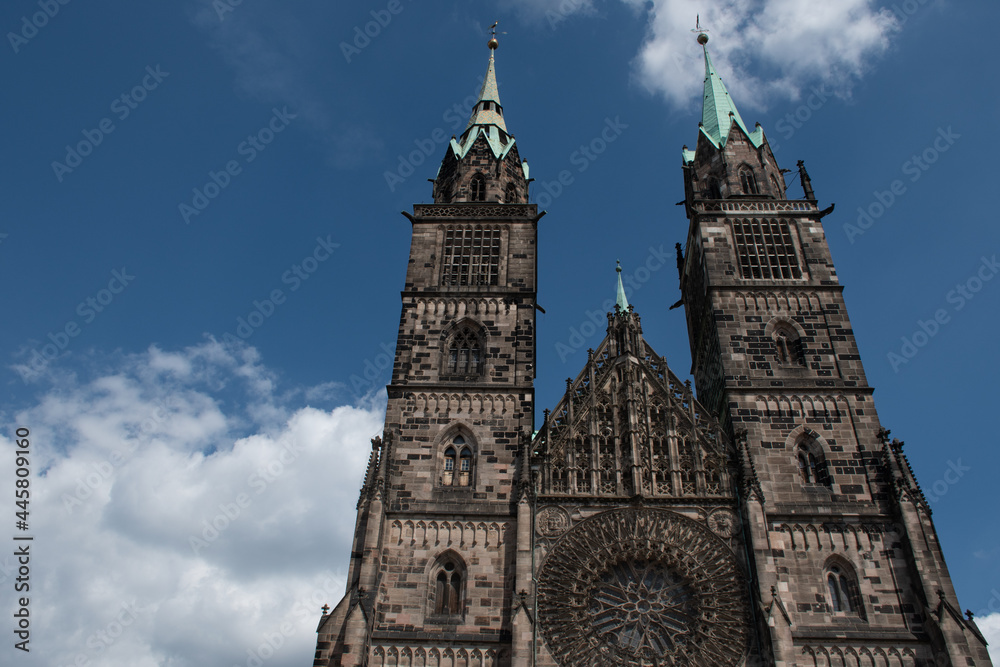 Fototapeta premium Top of the west facade of the medieval Evangelical Lutheran Church of St. Lorenz (St. Lawrence) in Nuremberg, Germany
