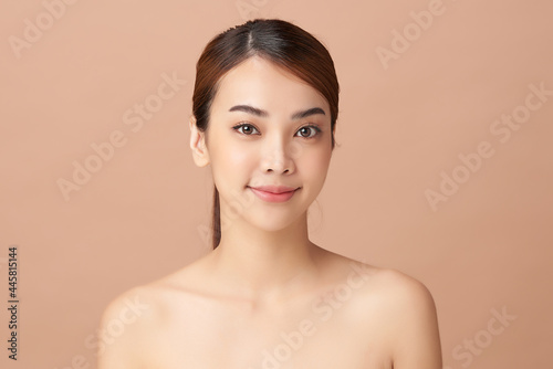 Beautiful young asian woman with clean fresh skin on beige background  Face care  Facial treatment  Cosmetology  beauty and spa  Asian women portrait.