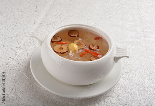 Chinese chilled hashima and herbal red dates sweet soup in white bowl asian healthy Halal dessert menu photo