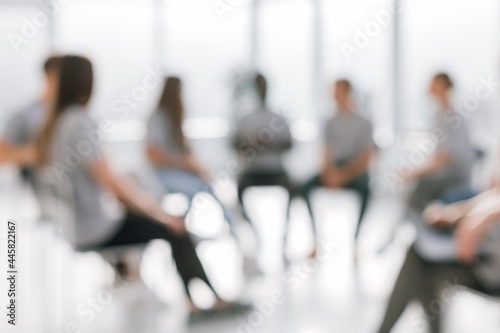 Obraz na płótnie background image of a group of young people sitting in a circle w salonie