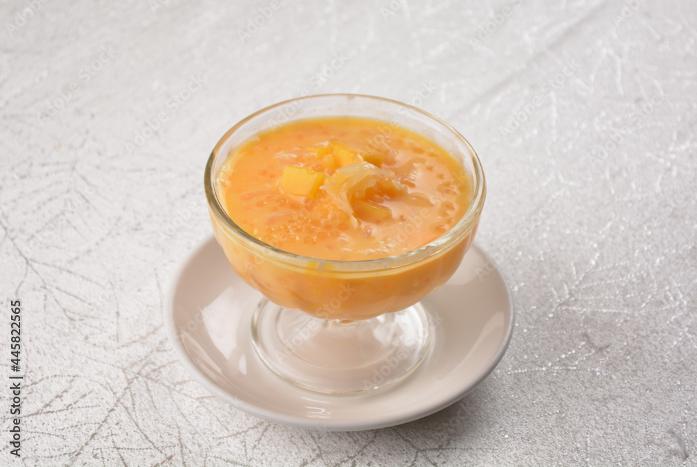 chilled sweet yellow mango fresh fruit sago puree soup with pomelo in cocktail glass asian healthy Halal dessert menu chilled sweet yellow mango fresh fruit sago puree soup with pomelo in cocktail glass asian healthy Halal dessert menu