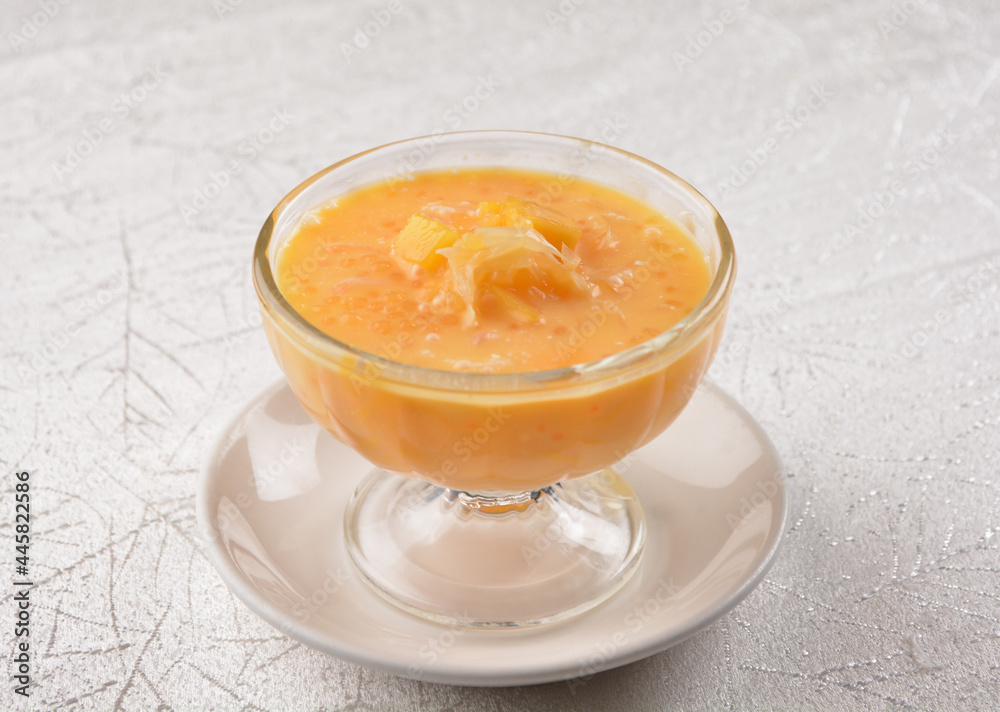 chilled sweet yellow mango fresh fruit sago puree soup with pomelo in cocktail glass asian healthy Halal dessert menu chilled sweet yellow mango fresh fruit sago puree soup with pomelo in cocktail glass asian healthy Halal dessert menu