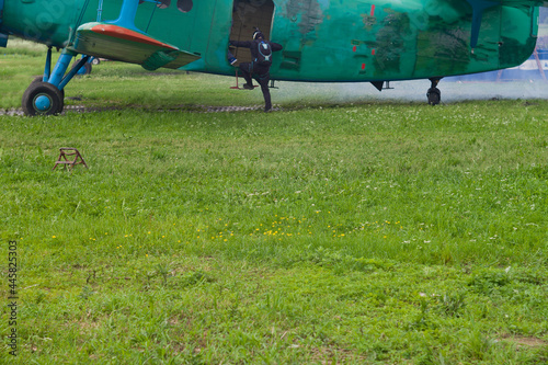parachuter climbing ino a plane photo