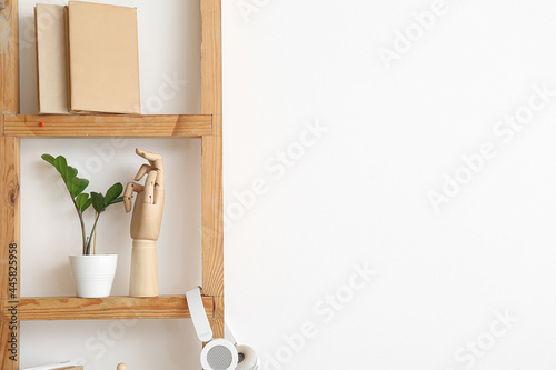 Wooden hand, books and hous...