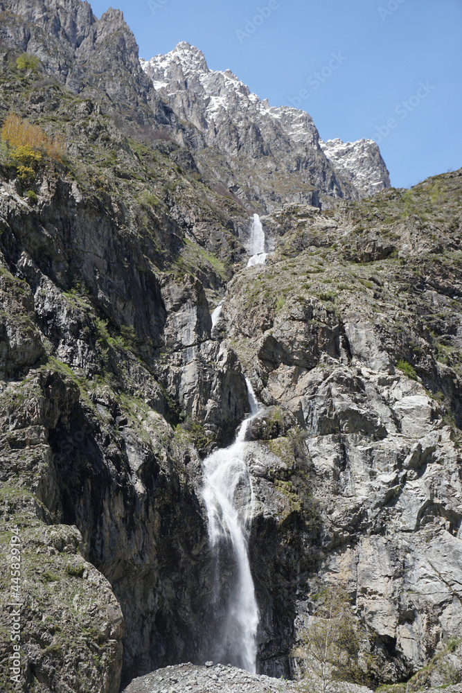 waterfall in the mountains of the alps, france