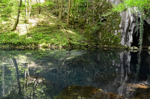 a clean river and a reflection in it