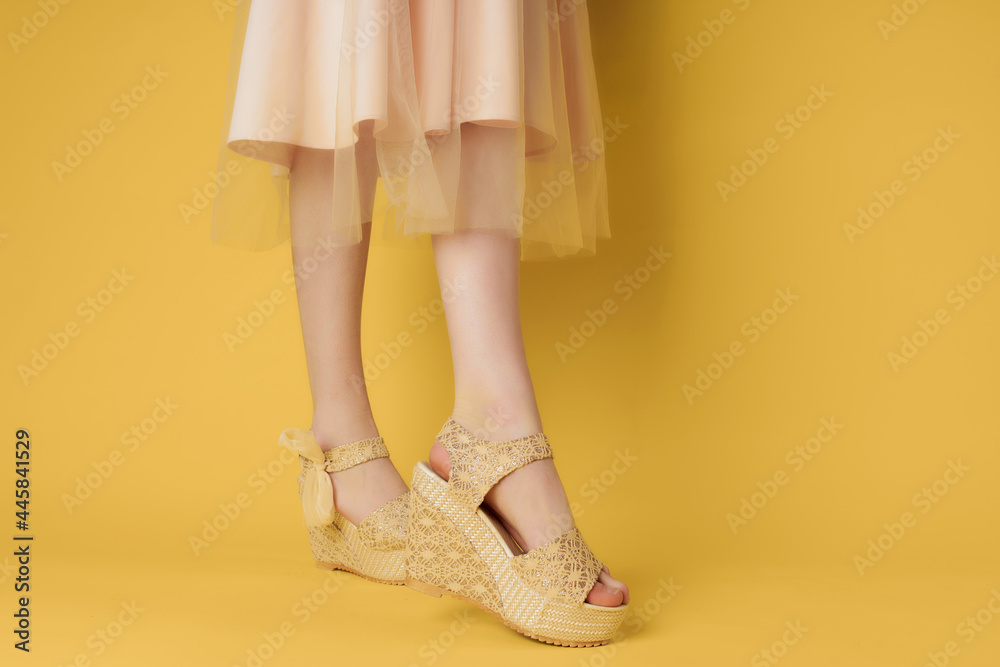 womens shoes beige yellow background posing fashion womens shoes beige yellow background posing fashion