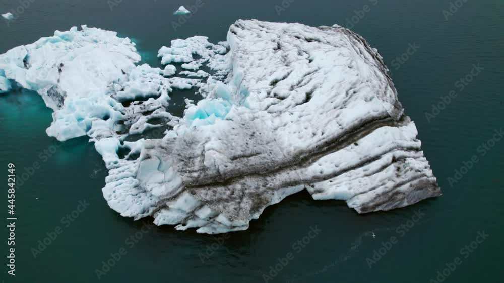 Top Down Aerial Shot of the Beautiful Ocean Scenery With Iceberg Scattered Top Down Aerial Shot of the Beautiful Ocean Scenery With Iceberg Scattered