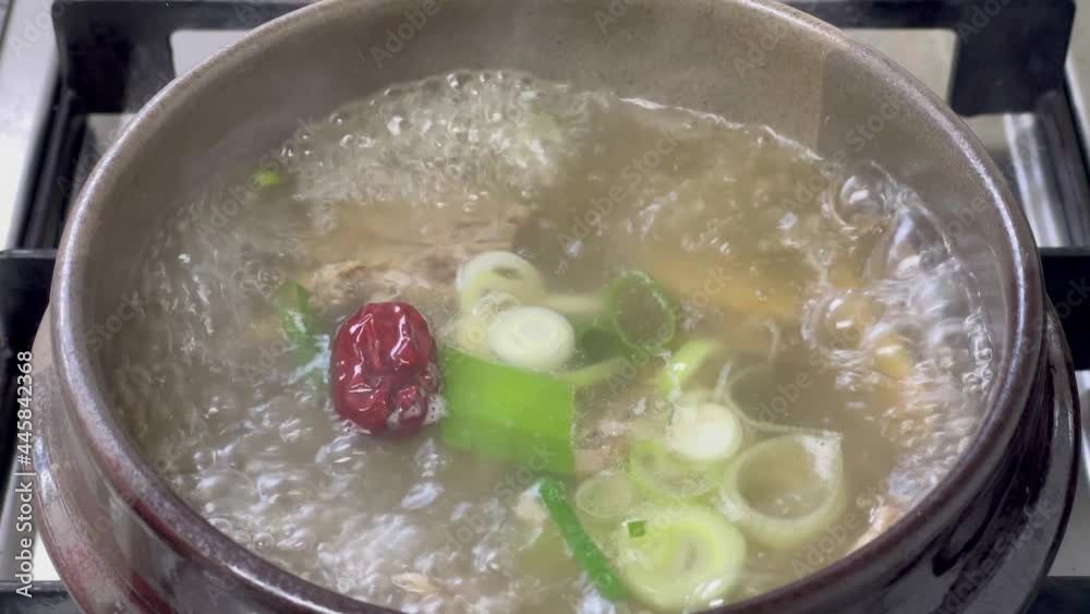 hot beef bone soup, Korean traditional food Gomtang, boiling in a hot pot hot beef bone soup, Korean traditional food Gomtang, boiling in a hot pot