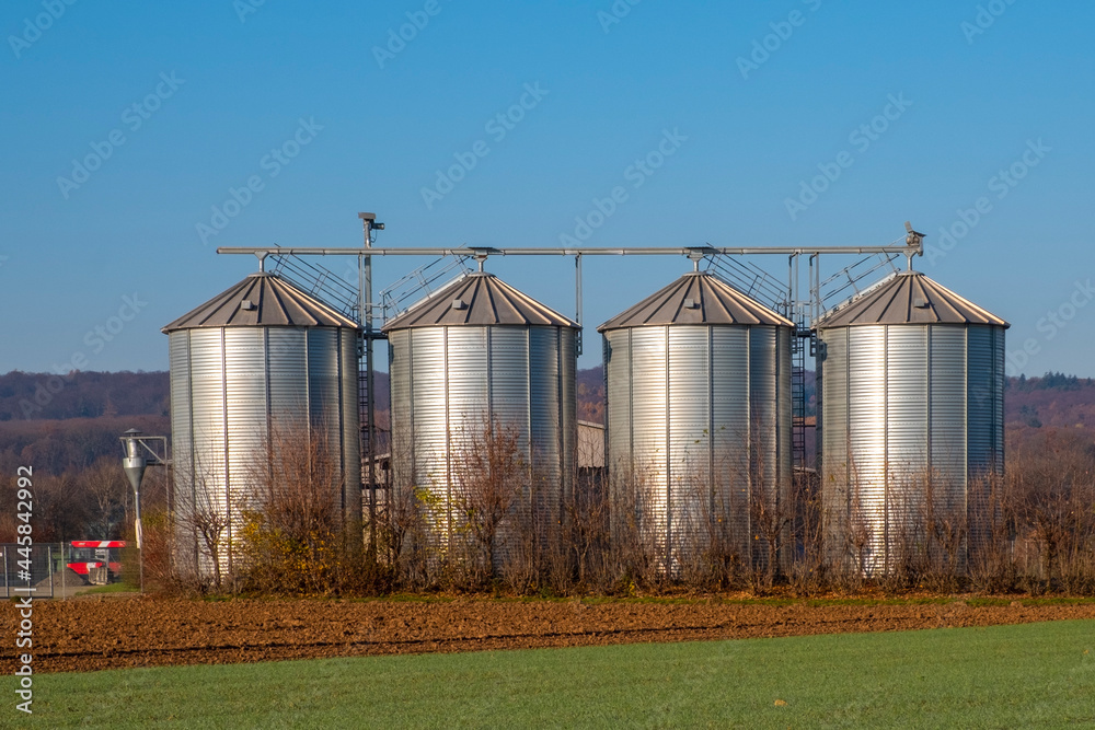 silver shining silos at the field silver shining silos at the field