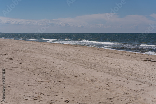 Fototapeta Naklejka Na Ścianę i Meble -  Waves crashing on the beautiful sandy beaches of the Baltic Sea