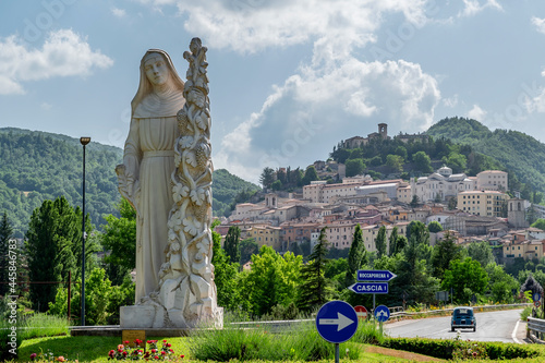 The statue of Santa Rita da Cascia welcomes the faithful at the entrance of the town, Cascia, Italy photo