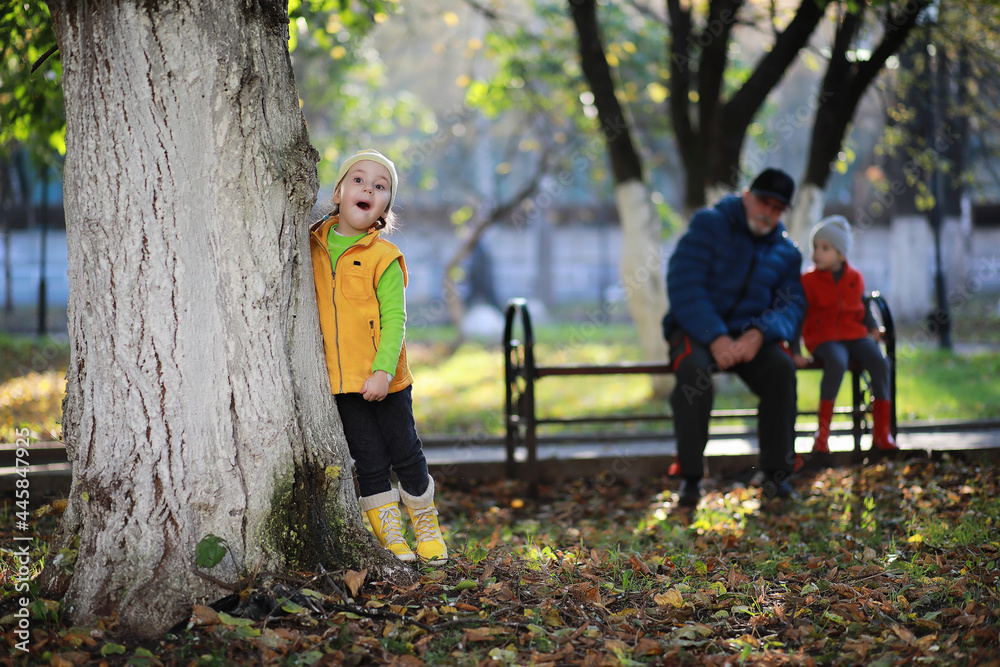 Children walk in the autumn park Children walk in the autumn park