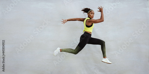 Fototapeta Naklejka Na Ścianę i Meble -  Fitness woman jumping