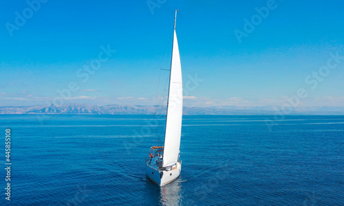 Aerial view of sailing luxury yacht at opened sea at sunny day in Croatia