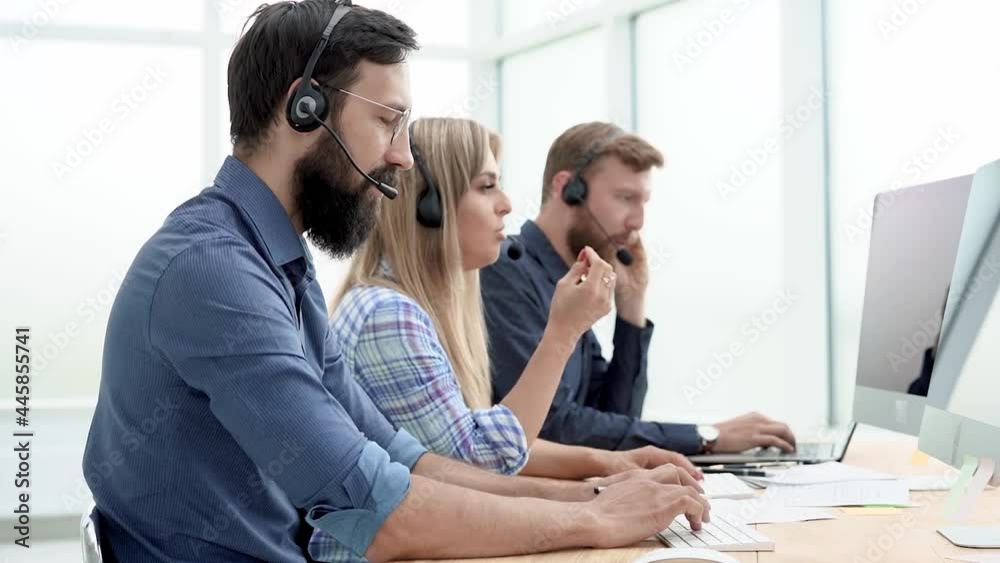 call center operators in the headset at the workplace. call center operators in the headset at the workplace.