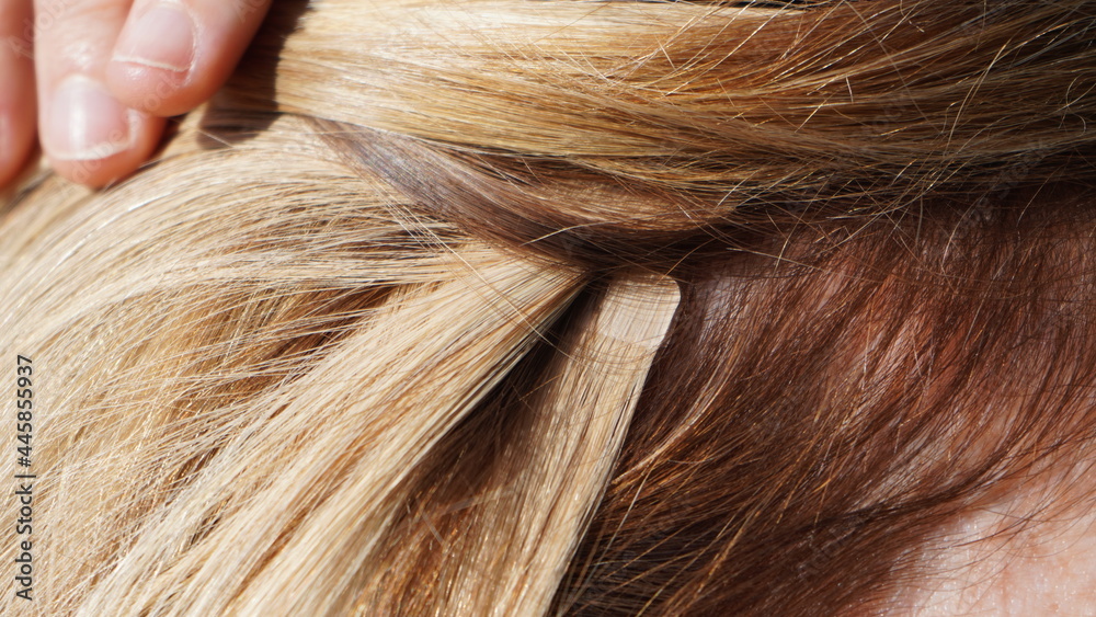 hair extensions in blond girl, womans hair, professional from hairdresser, tape in extensions hair extensions in blond girl, womans hair, professional from hairdresser, tape in extensions
