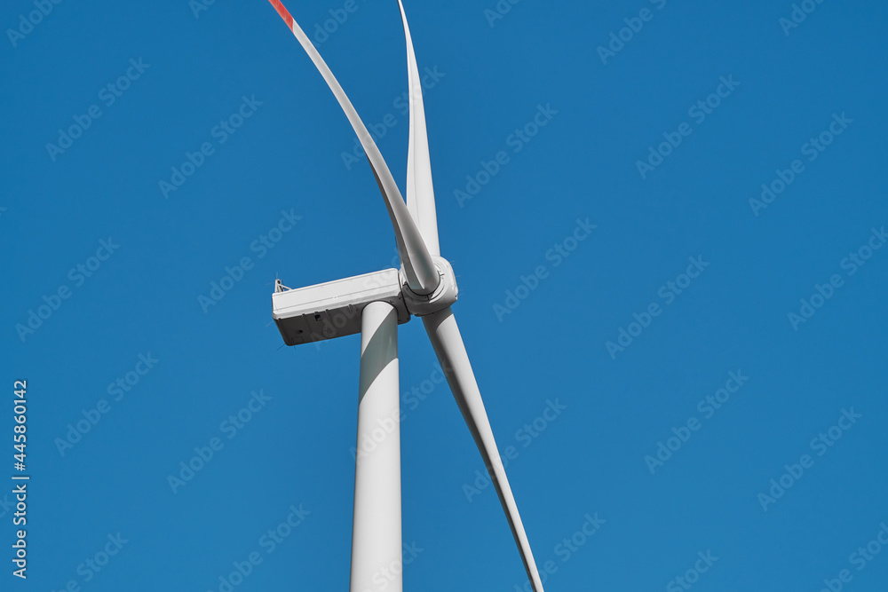 View from below of wind turbines. Wind turbine details.
View from below of wind turbines. Wind turbine details.