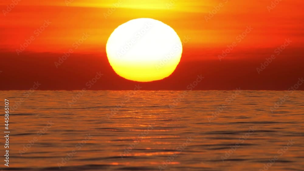 Big Sun at Sunset 4k over Sea or Ocean Time Lapse, Closeup Telephoto Lens. Travel, Beginning, Nature Concept Big Sun at Sunset 4k over Sea or Ocean Time Lapse, Closeup Telephoto Lens. Travel, Beginning, Nature Concept