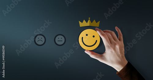 Customer Loyalty Concept. Client Experiences. Happy Customer giving Positive Services Rating for Satisfaction present by Smiling Face and Crown photo