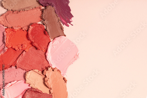 Various lipstick smudged. Mat lipstick texture background. Cosmetic product sample