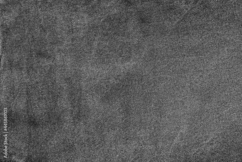 dark spotted texture of old denim in black and gray