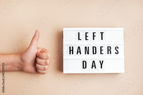 Light box with text left handers day photo