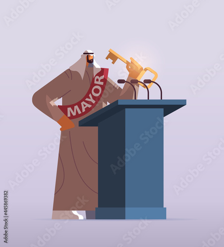 arab mayor with key giving speech from tribune public statement concept full length