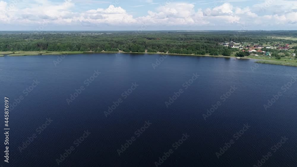 Aerial view of a lake in Shatsky National Natural Park, Ukraine. Blue water and green trees. Soft blue water wave, turquoise waves, clear water surface. Nature surface background 4k Aerial view of a lake in Shatsky National Natural Park, Ukraine. Blue water and green trees. Soft blue water wave, turquoise waves, clear water surface. Nature surface background 4k