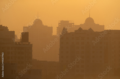 Silhouette of buildings during Sunrise, a view from Tubli bay, Bahrain
