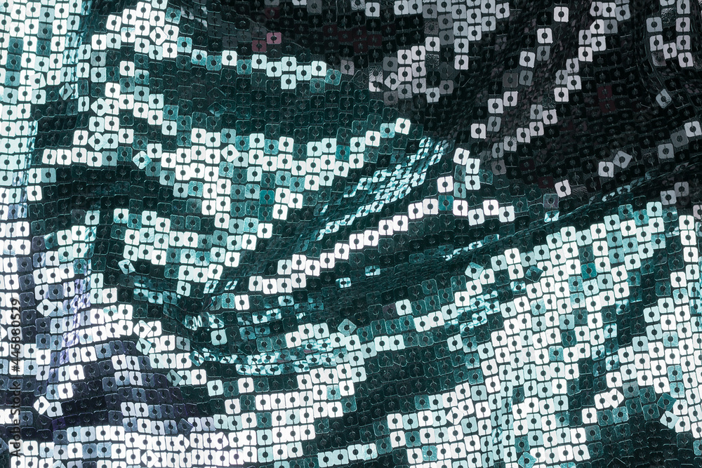 Fototapeta premium Texture of the surface of the fabric made of sequins. Fashion fabric glitter, sequins. beautiful shiny texture background