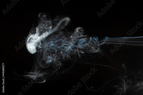 Abstract smoke isolated on black. White smoke on a black background.