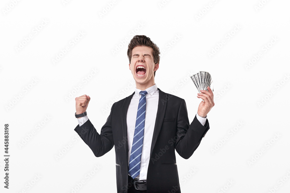 Excited businessman with money celebrating success Excited businessman with money celebrating success