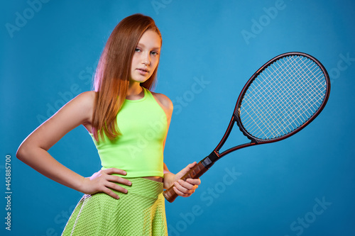 girl teenager with racket in sporswear and hat © producer