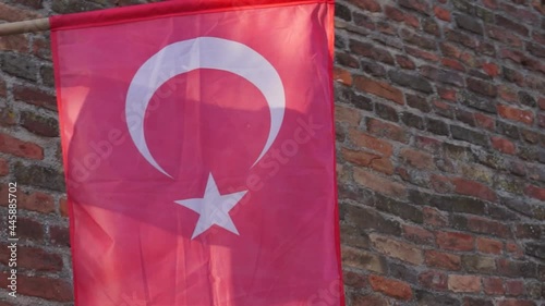 National red Turkey flag at old brick wall