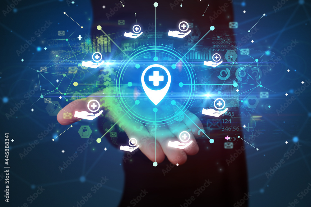 Fototapeta premium Hand holding healthcare icons concept