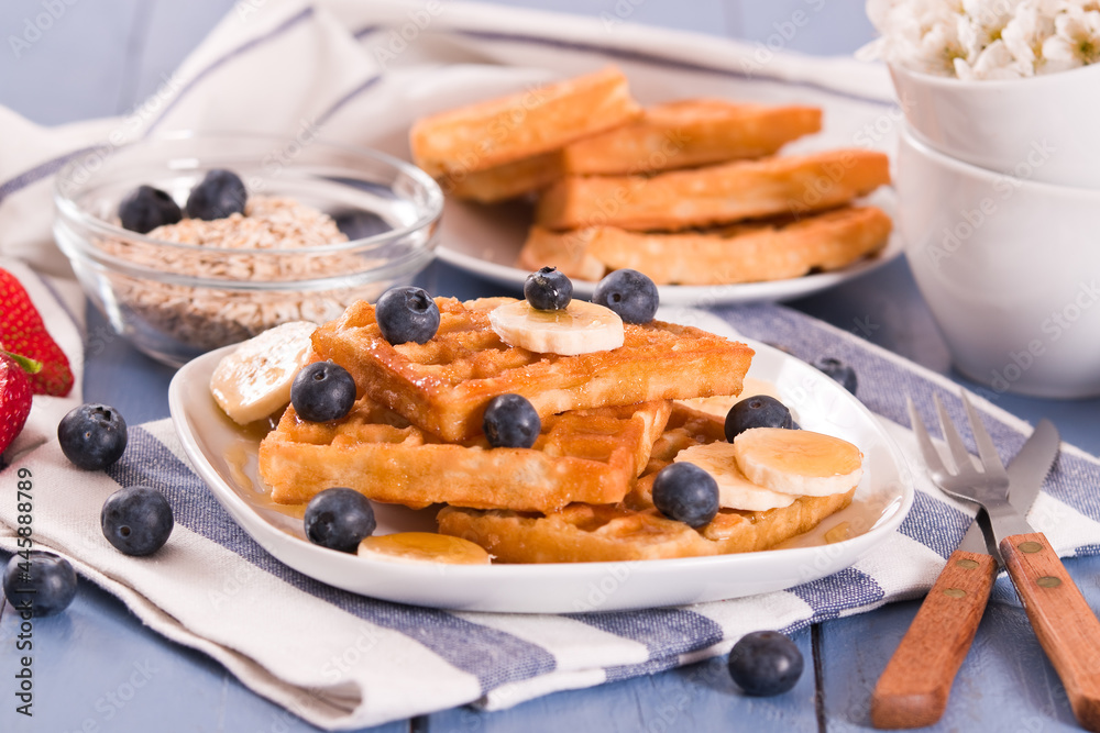 Waffles with blueberries, bananas and honey. Waffles with blueberries, bananas and honey.