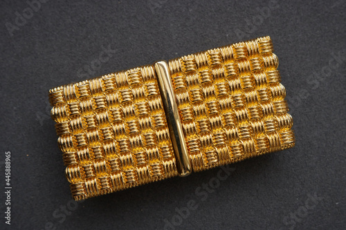 80s vintage braided shape belt buckle on black background