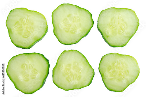 Fresh cucumber slices isolated on white background, top view. Fresh cucumber slices isolated on white background, top view. Cucumber slices isolated on white. Set of fresh round cucumber slices.