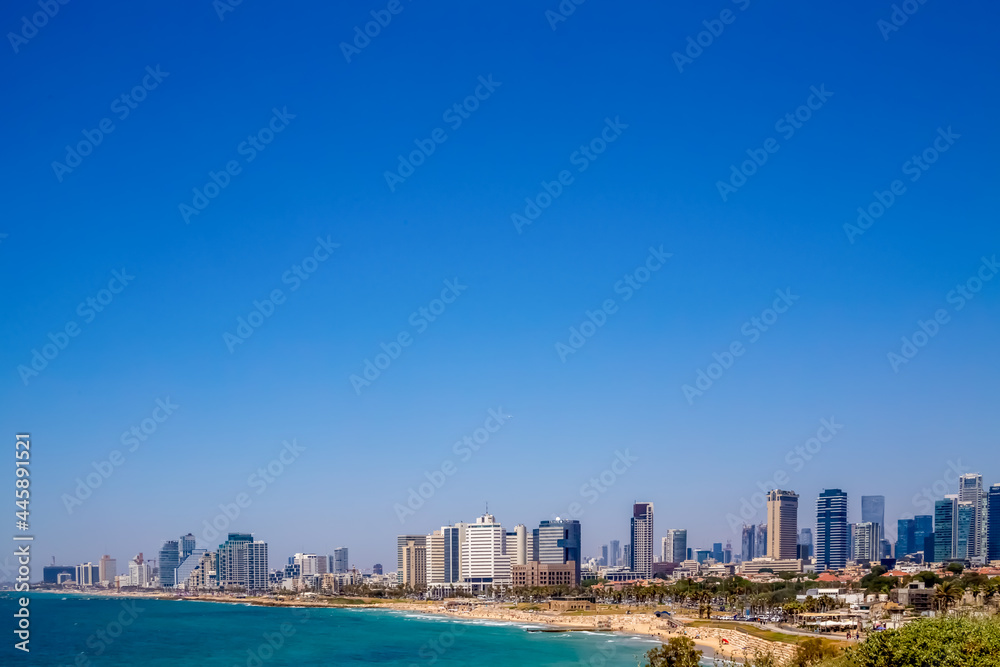 Fototapeta premium Tel Aviv, Israel - June 27, 2021: Tel Aviv view from Jaffa on a sunny day