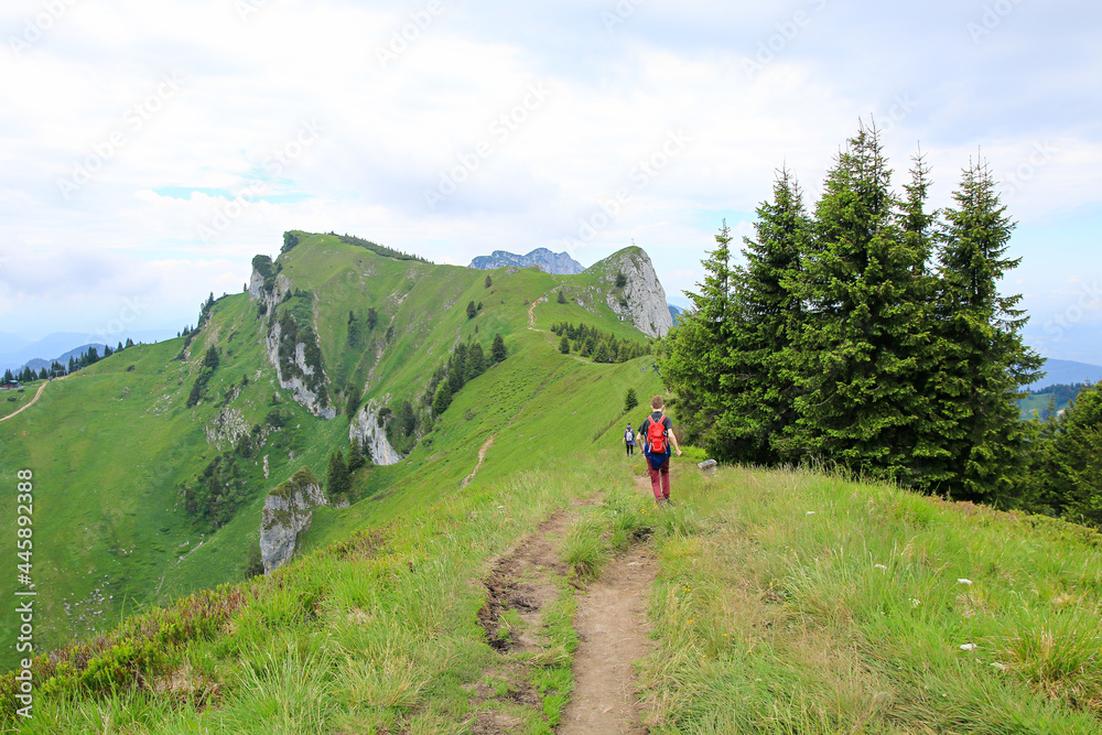 hiking with children at idyllic ridgeway Brauneck mountain