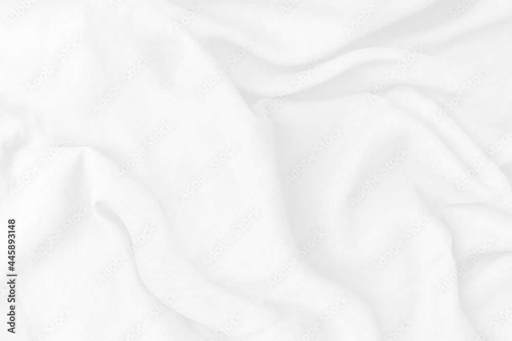 Cotton textile is wave beautiful  for wallpaper. Top view white fabric luxurious softness smooth on white background with copy space. Design textured, abstract, background.